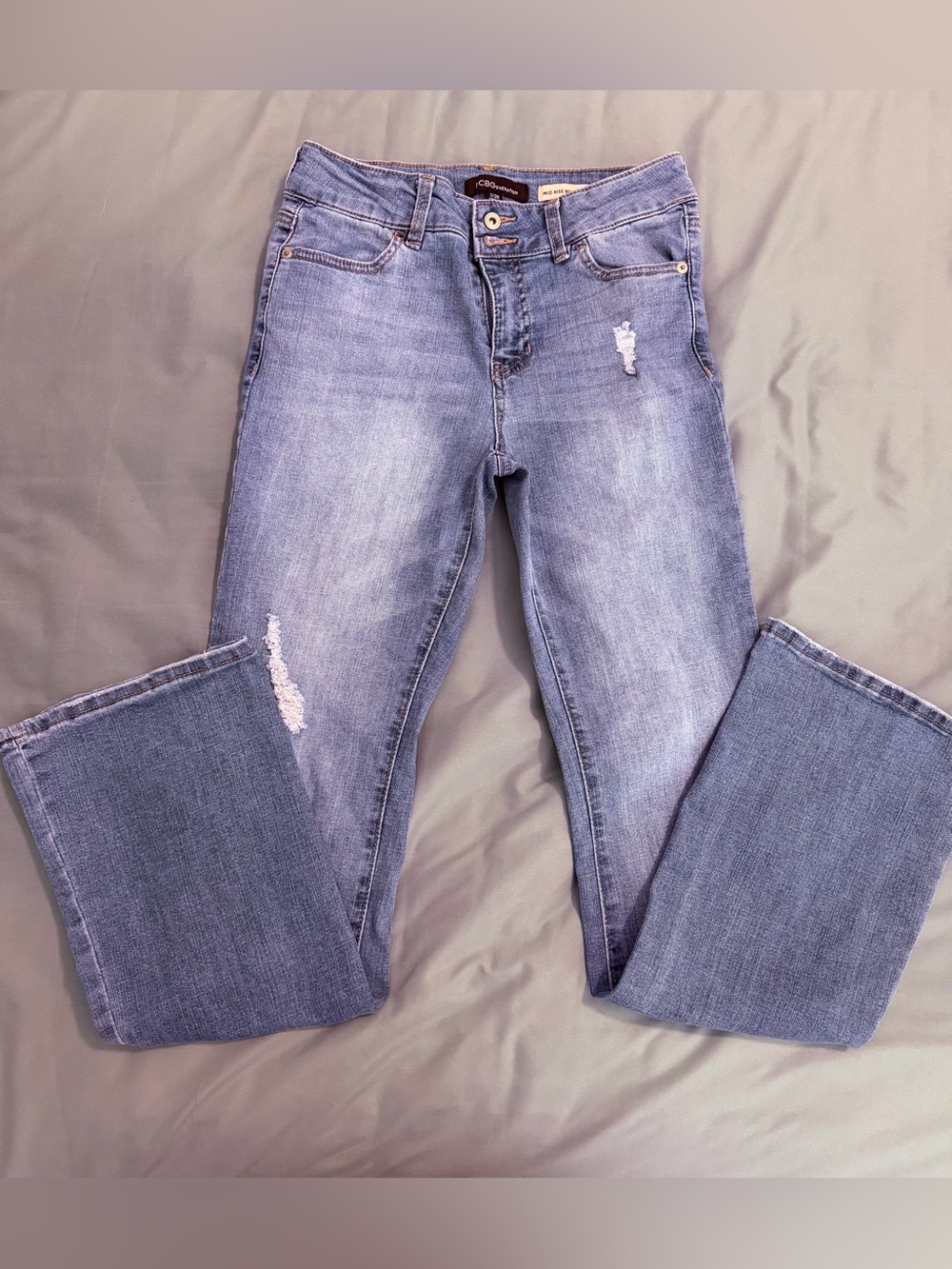 BCBGeneration Light Blue Bootcut Jeans with Distressed Details